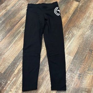 Pink Victoria’s Secret black leggings with dog logo, excellent used condition.